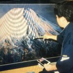 富士山を描く後ろ姿（小川憲一豊実）